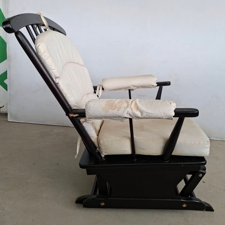 Vintage Wooden Rocking Chair with Cushioned Seat  Description: