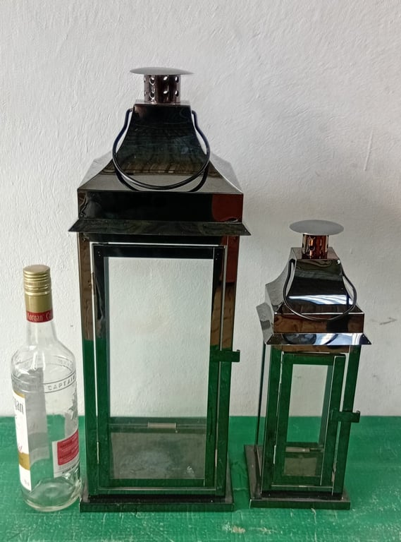 A set of 2 chrome metal & glass lanterns