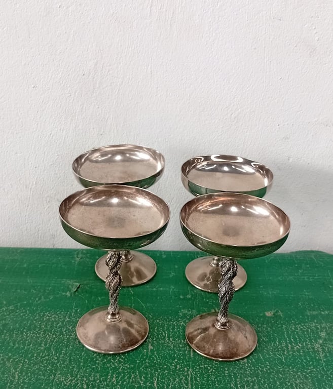 A set of vintage silver-plated champagne coupes