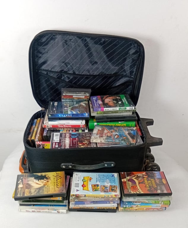 Suitcase filled with collection of DVDs & CDs