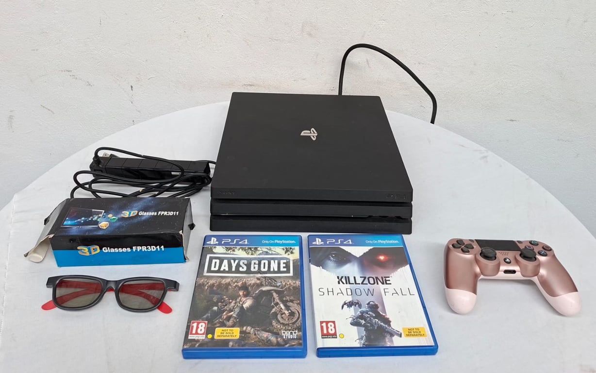 Sony PlayStation 4 Slim Console with Accessories and Games