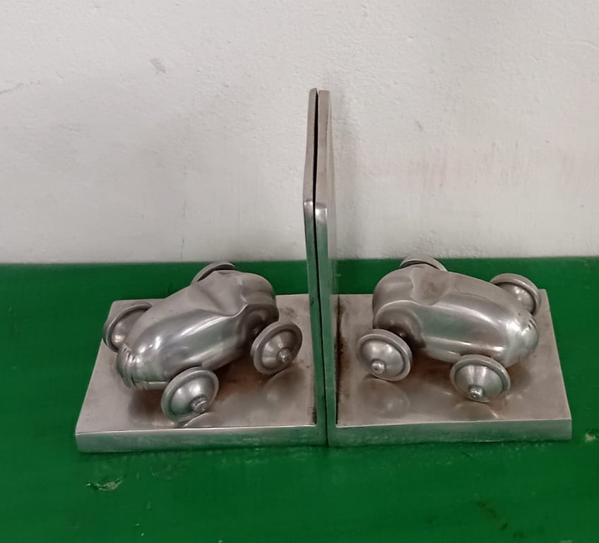 A Pair Of Polished Aluminium Car Bookends