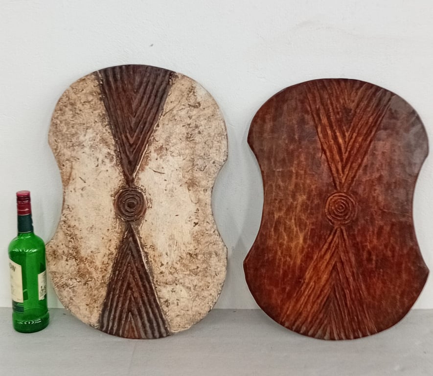 A pair of large hand-carved wooden decorative panels