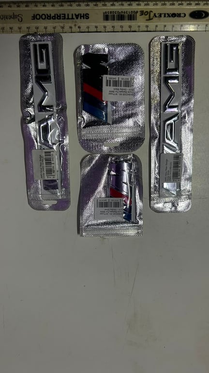 Mercedes Benz AMG and BMW M series emblems