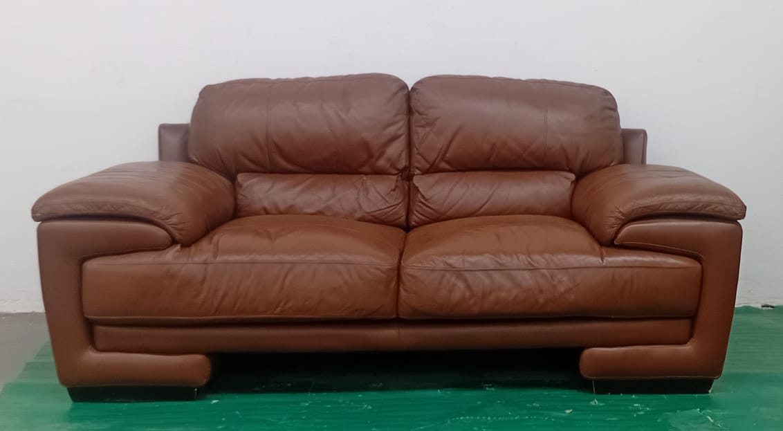 Two-seater brown leather couch