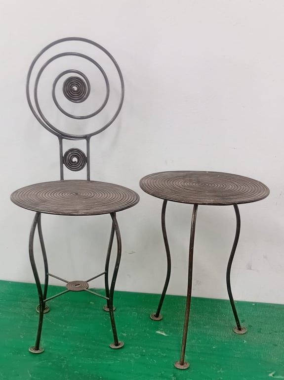 A Set Of Wrought Iron Table & Chair