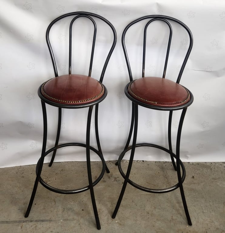 A pair of metal bar stools