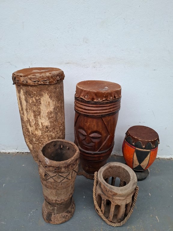 Collection of Hand-Carved African Wooden Drums (4-Piece Ensemble)