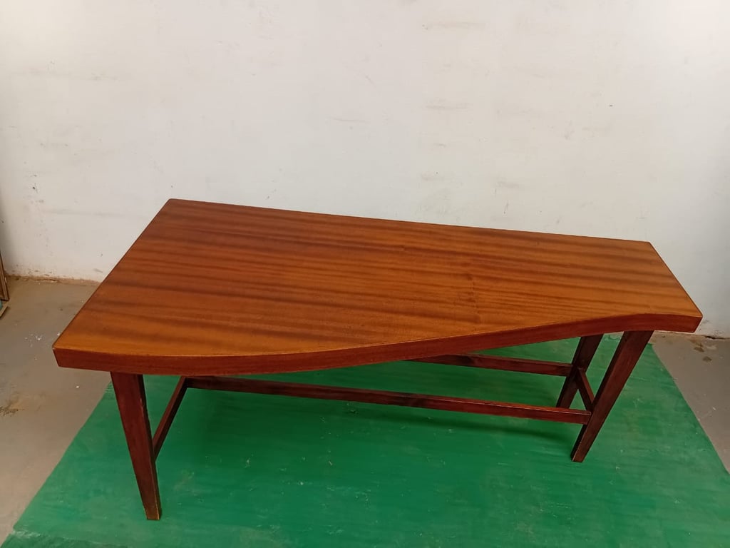 Wooden Table With Curved Tabletop Design