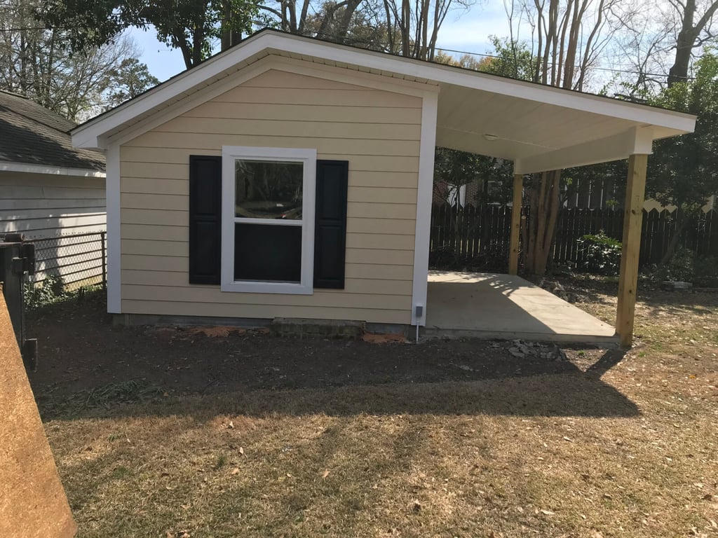 the rebuilt shed with new Hardie siding and windows built by window and door contractors near me Dennis Home improvement