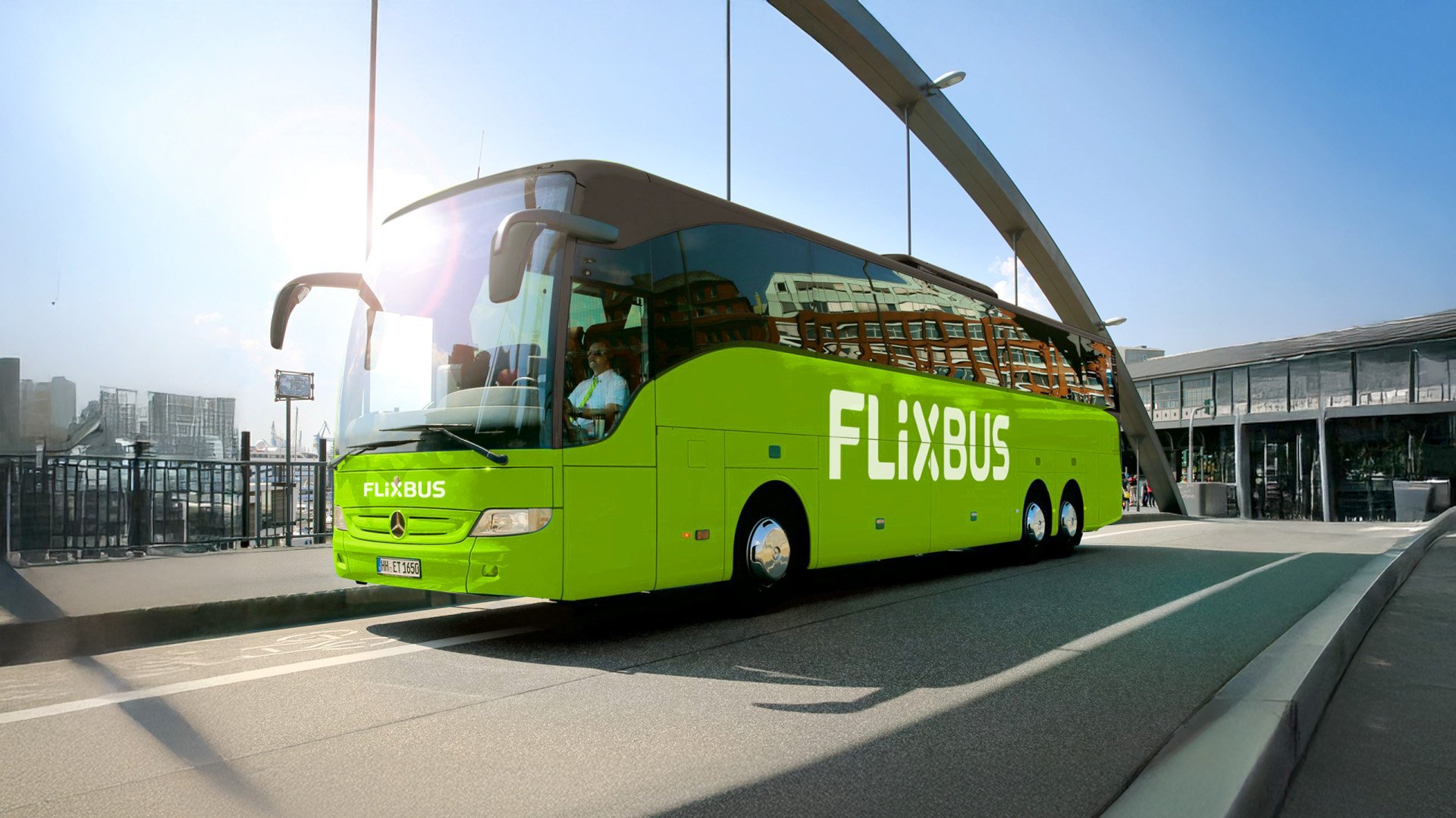 A FlixBus coach at a city bus terminal, one of around 1,700 vehicles equipped with onboard bus Wi-Fi.