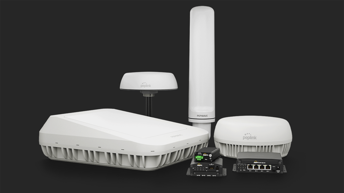 Compact Peplink router with external antenna ports beside a larger multi-port router.