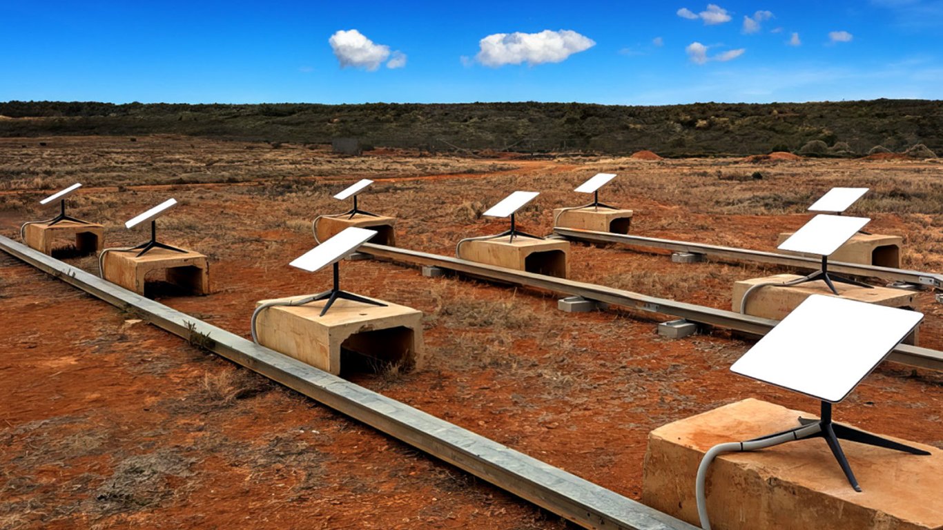 Multiple satellite terminals installed in an arid outdoor field representing Peplink construction case studies.