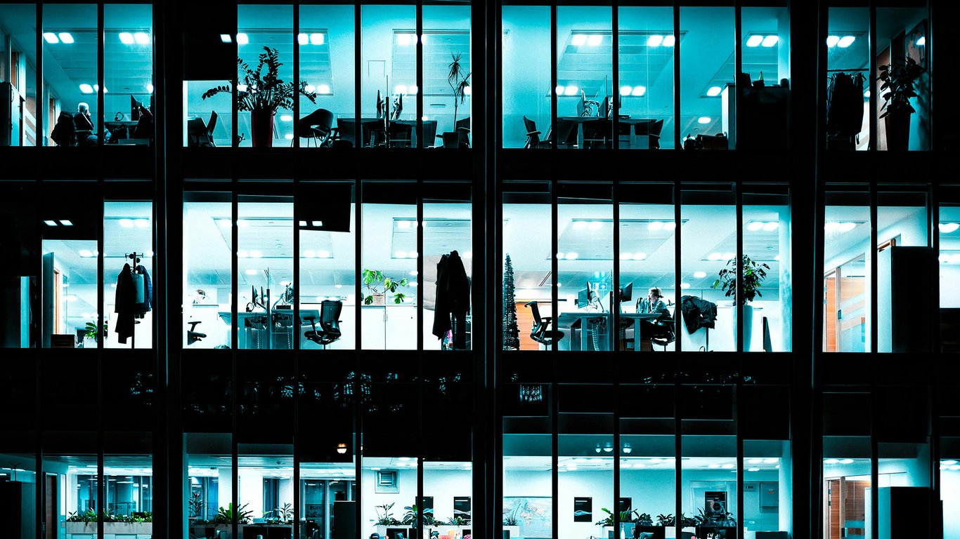Multi-storey office building at night representing Peplink branch edge connectivity solutions.