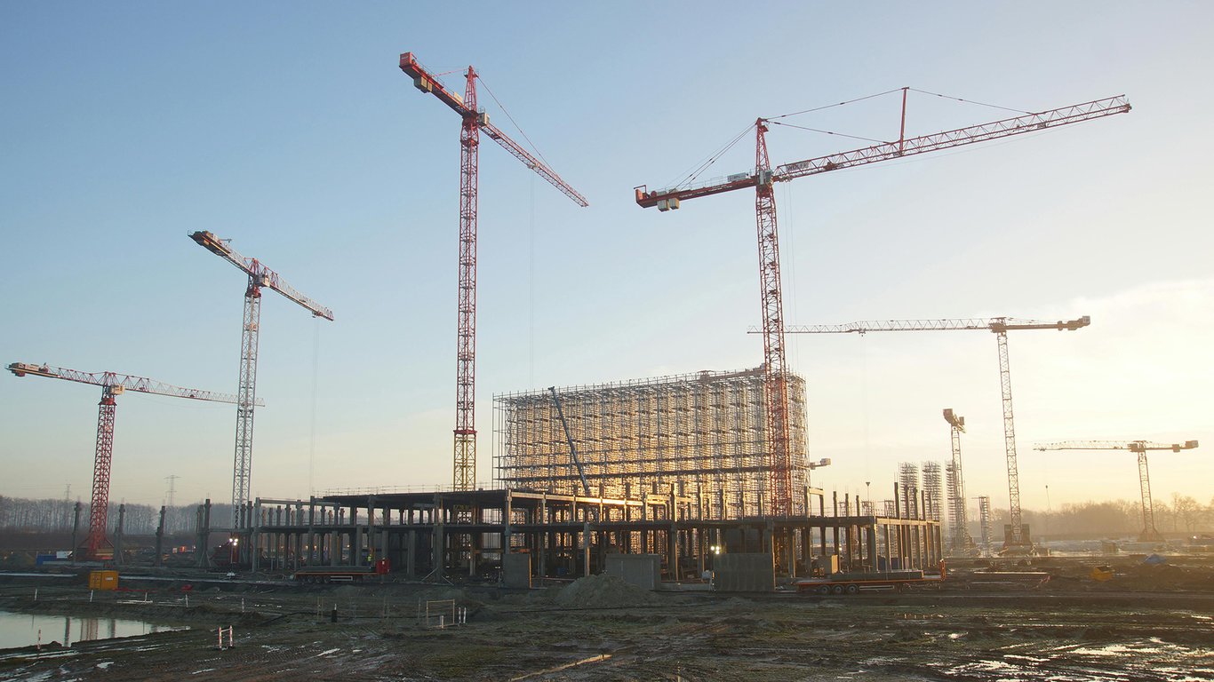Construction site with tower cranes representing Peplink construction connectivity solutions.