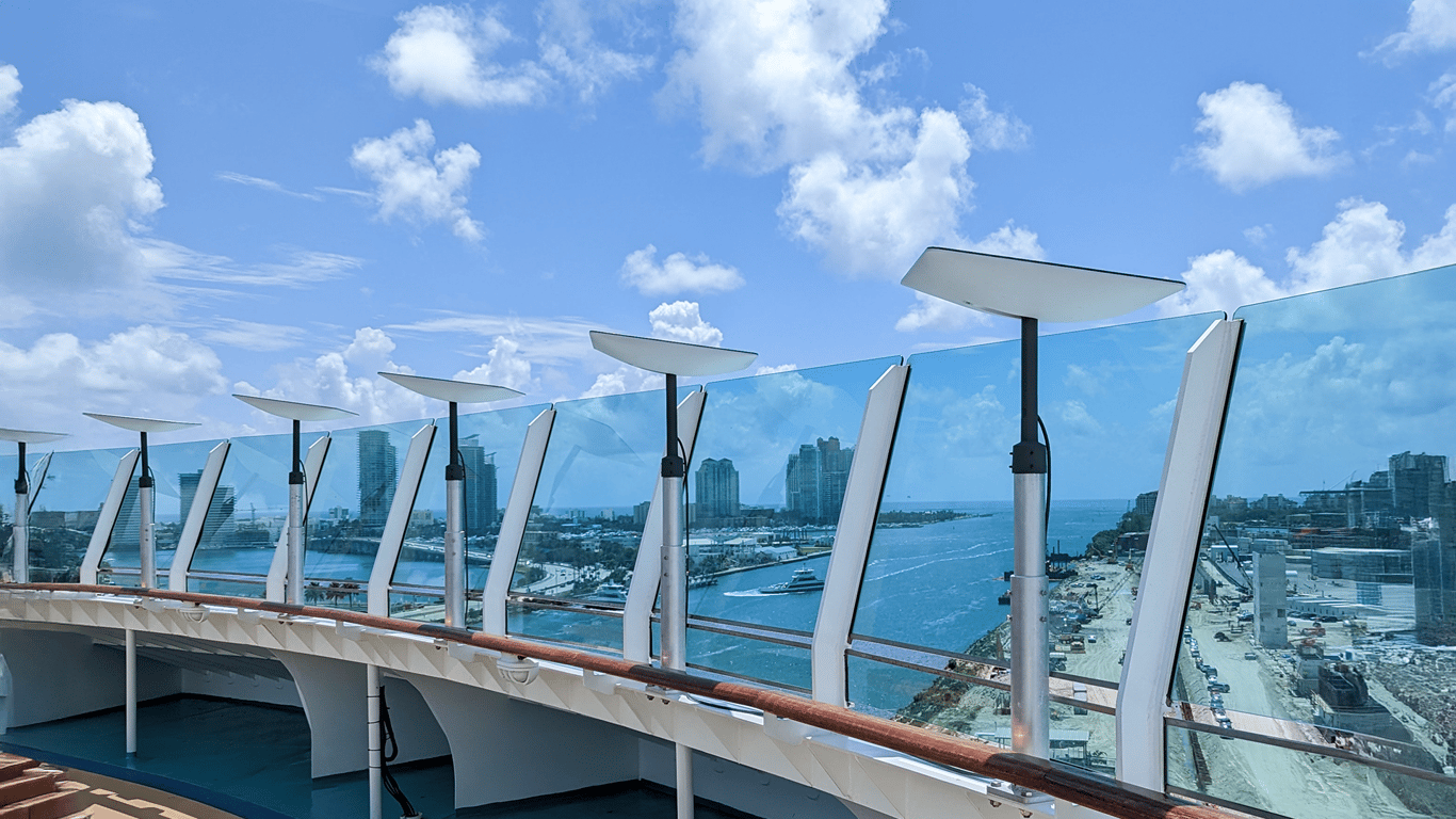 Multiple Starlinks installed on a cruise ship deck providing Peplink and Starlink bonded connectivity for maritime internet.
