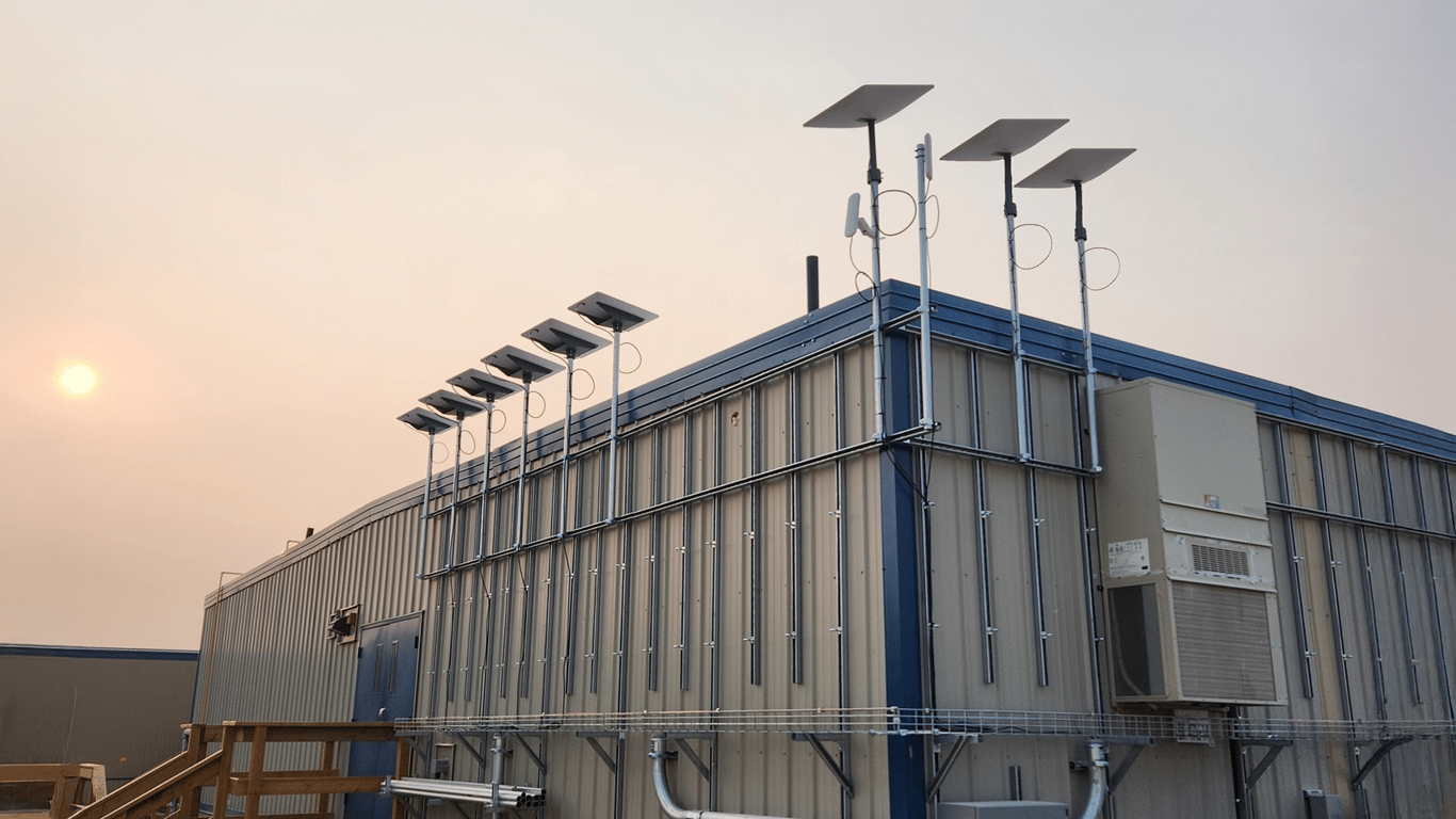 Multiple Starlinks mounted on a remote Canadian mining facility bonded with Peplink SpeedFusion for high-throughput connectivity.