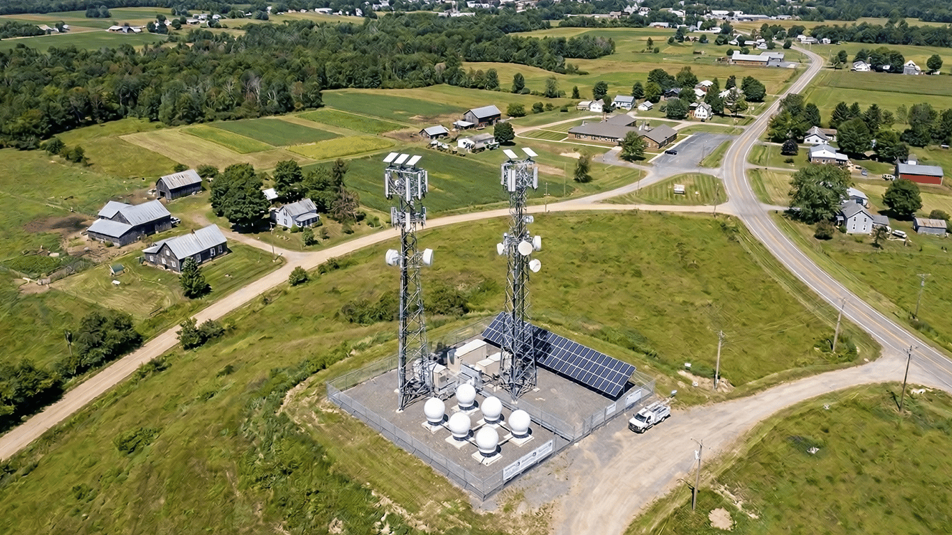 Rural WSIP tower with satellite dishes using Starlink and Peplink bonded backhaul connectivity.