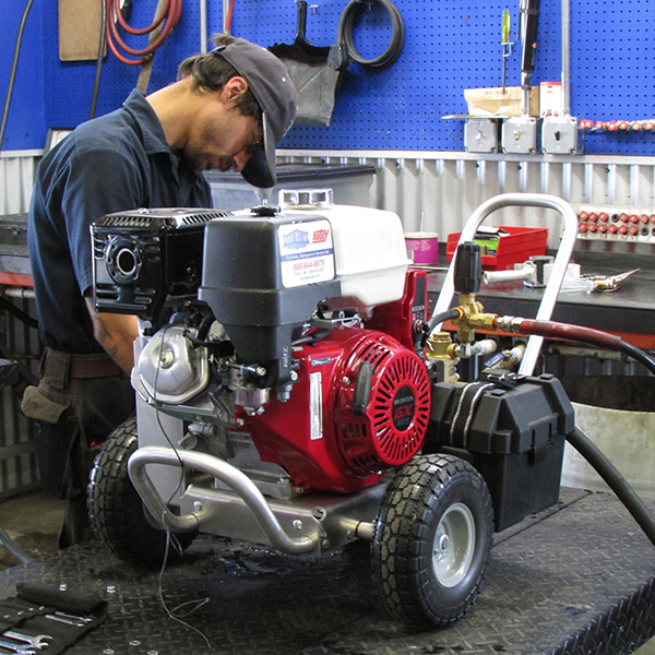 Northstar Service Tech Performing Routine Maintenance on Hotsy HD Pressure Washer
