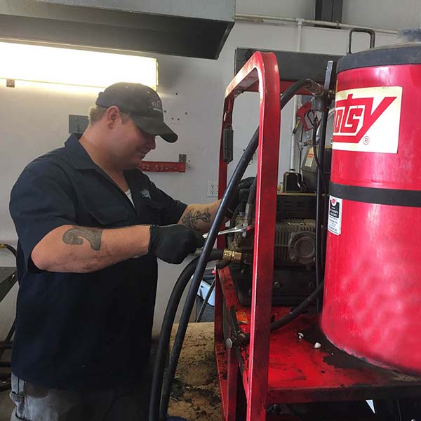 Northstar Service Technician Repairing Hotsy Pressure Washer