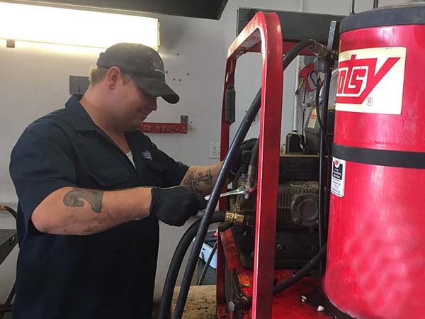 Northstar Service Technician Repairing Hotsy Pressure Washer