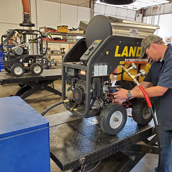 Technician Diagnosing Landa MHC Pressure Washer