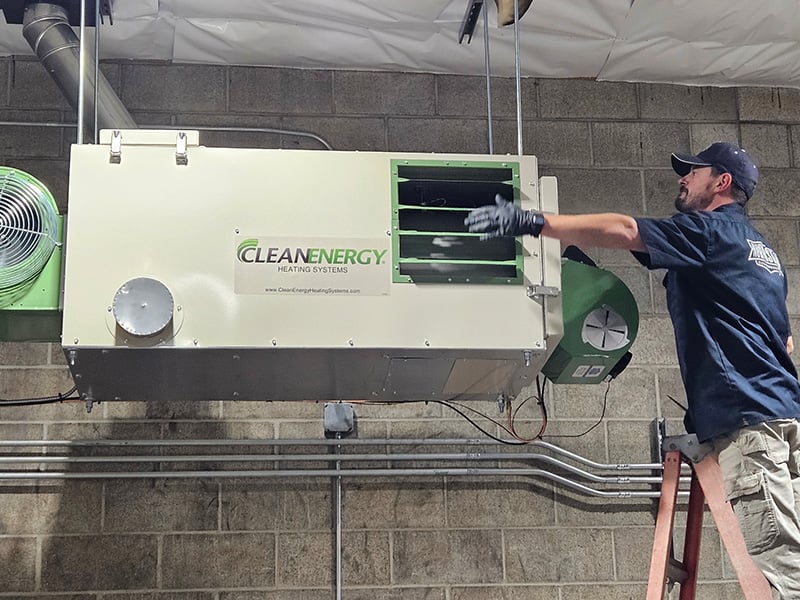 Northstar technician testing a waste oil heater