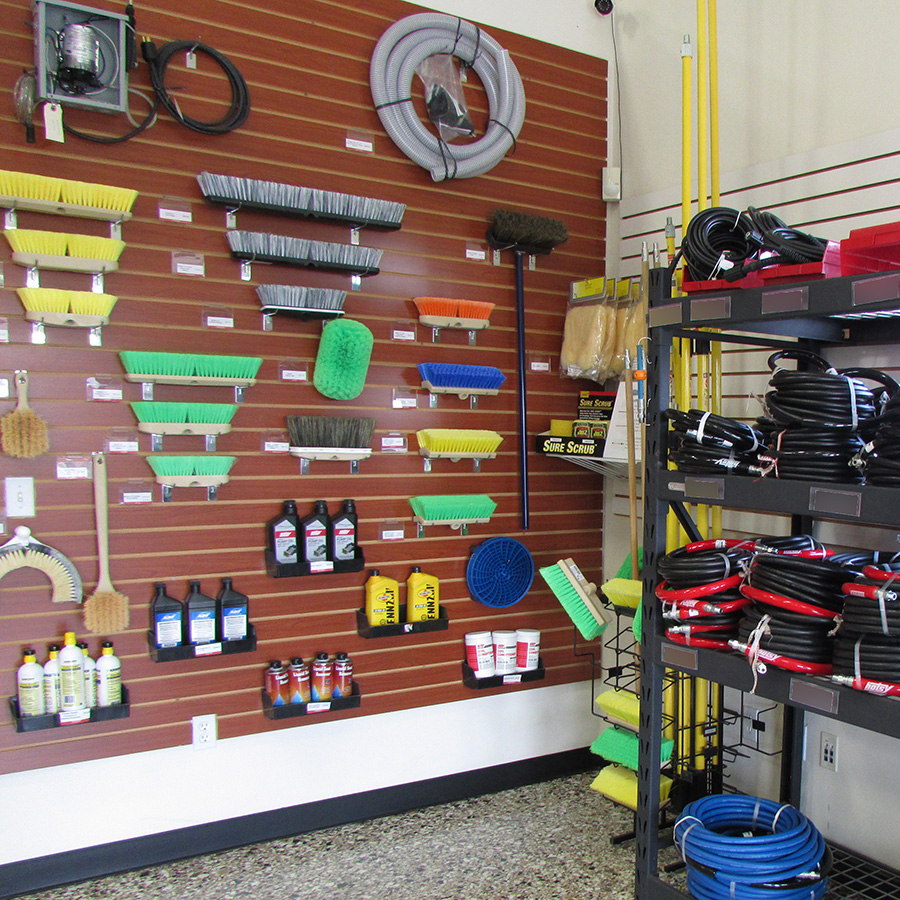 Brushes and Hoses Displayed on Wall