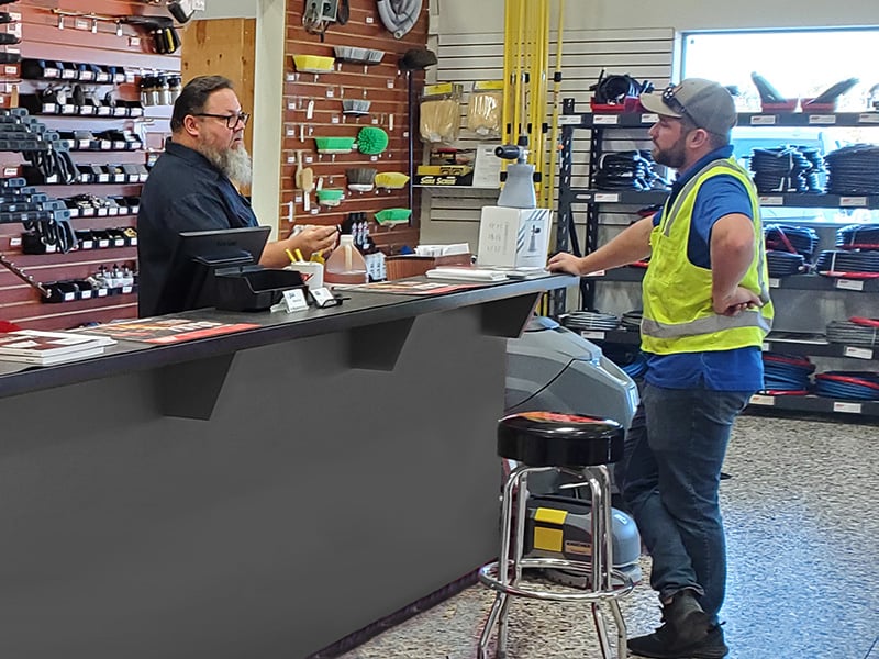 Shop Pressure Washer Parts Technician Helping Customer In Store