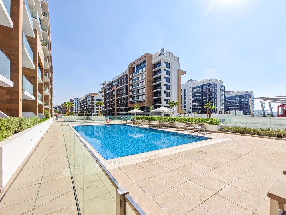 Outdoor swimming pool surrounded by residential buildings