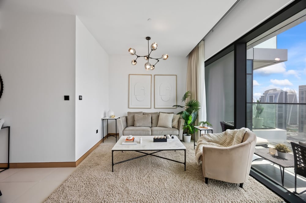 Living room with sofa and floor-to-ceiling windows