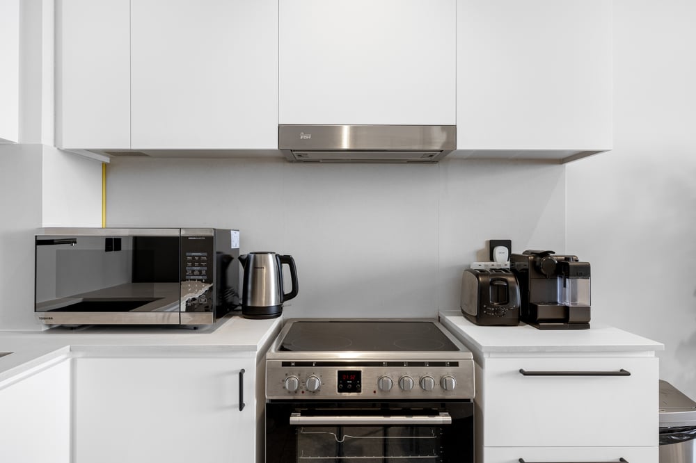 Kitchen with oven microwave kettle and coffee maker