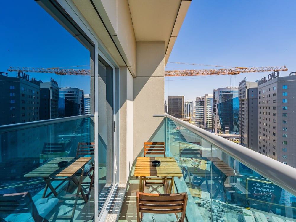 Balcony with seating and city skyline view