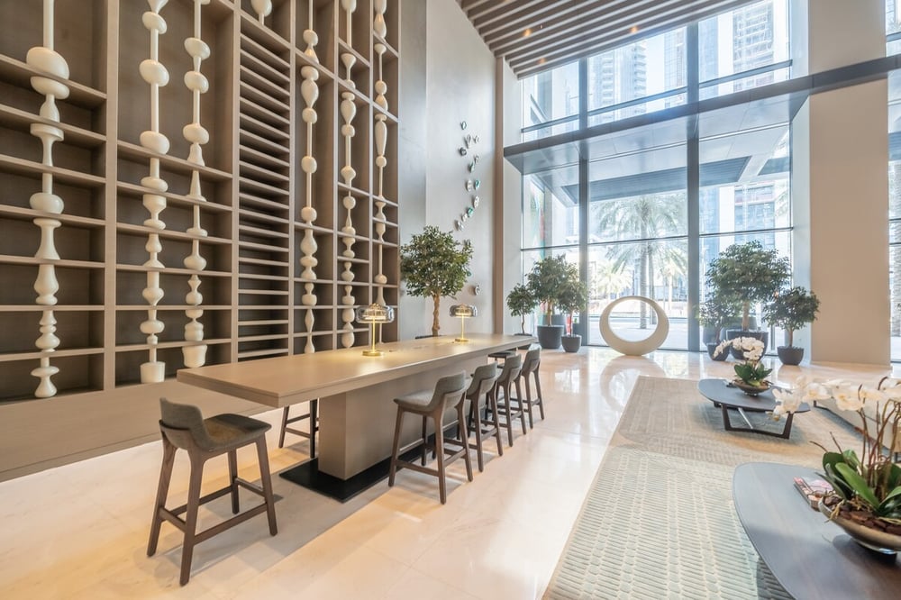 Building amenity area with bar-height seating and large windows