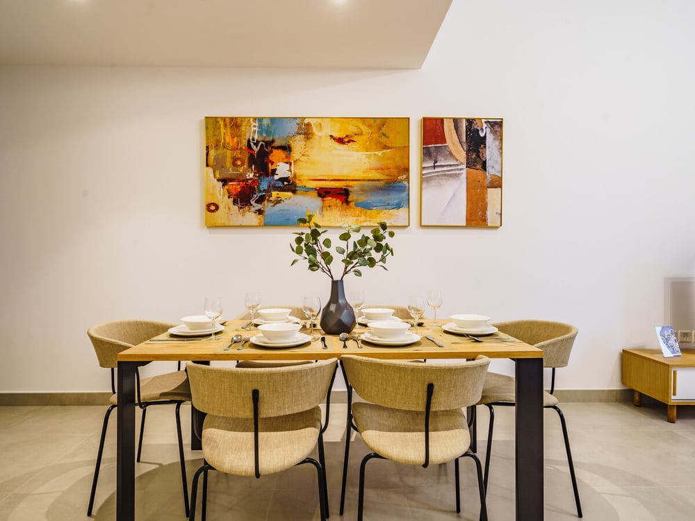 Dining area with wooden table and six chairs