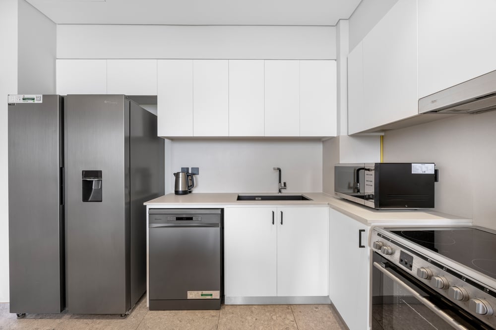 Kitchen with fridge freezer dishwasher and hob