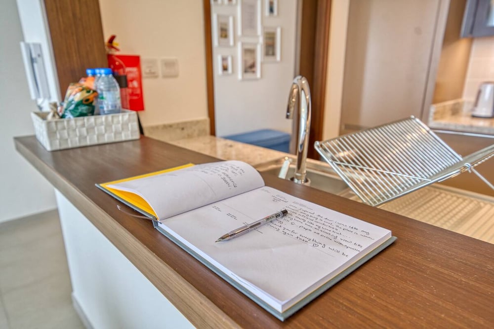 Kitchen counter with drying rack and guest book