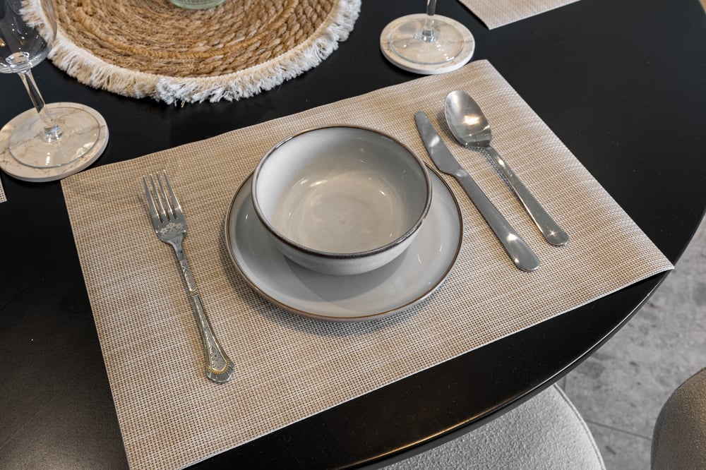 Place setting with bowl plate cutlery and wine glass