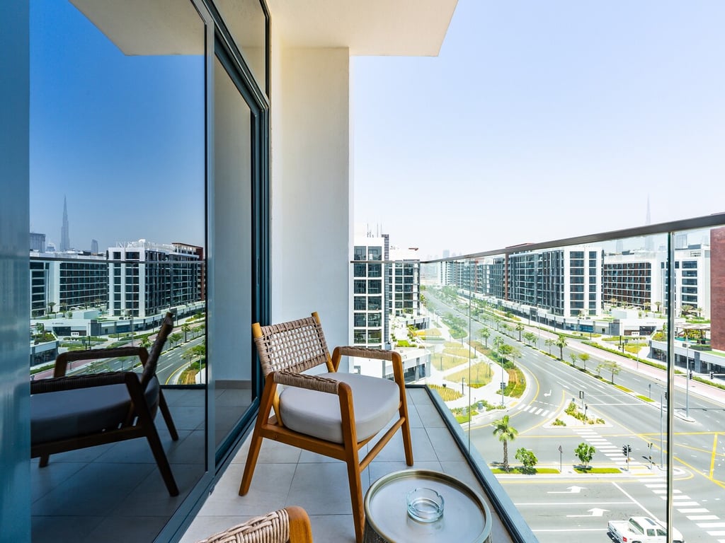 Balcony with chairs and city view