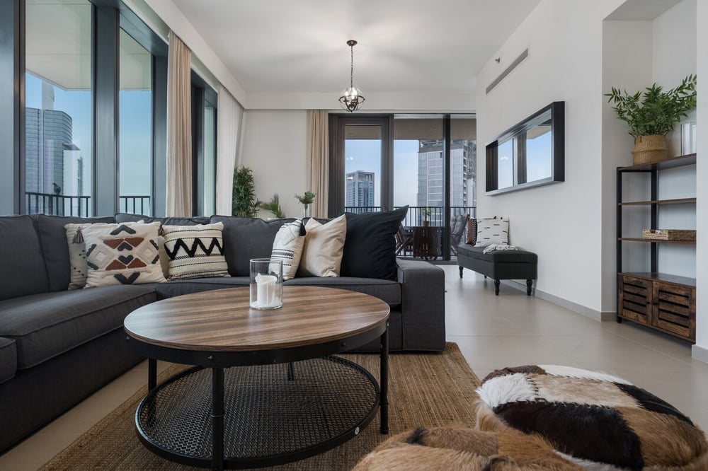 Living room with round coffee table and cowhide rug