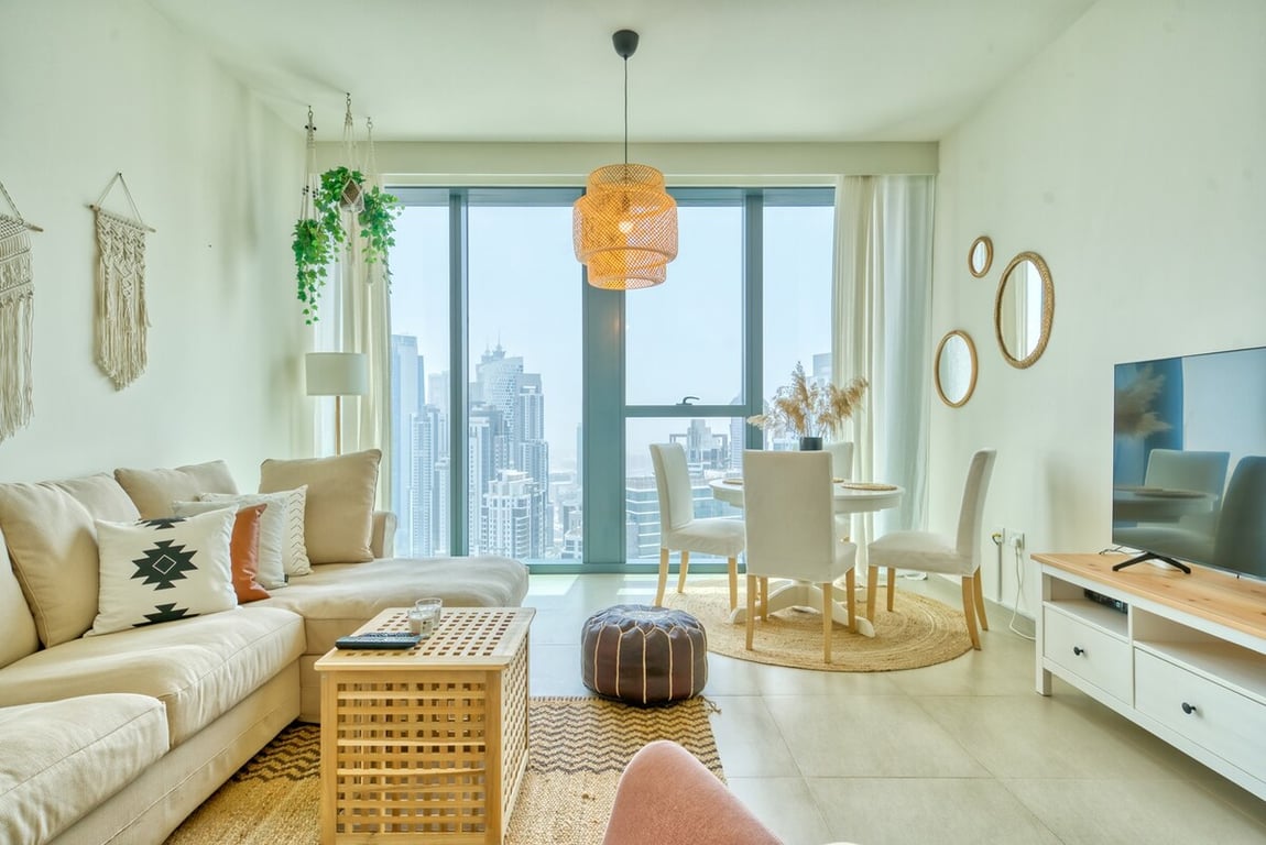Bright living and dining area with floor-to-ceiling window