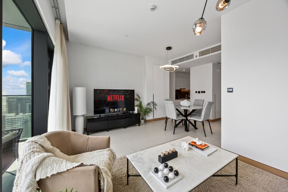 Living area with TV and open dining space