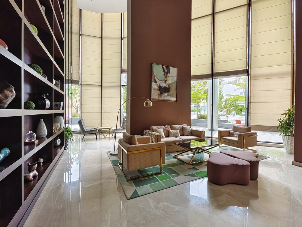 Building lobby with bookshelf wall and lounge area