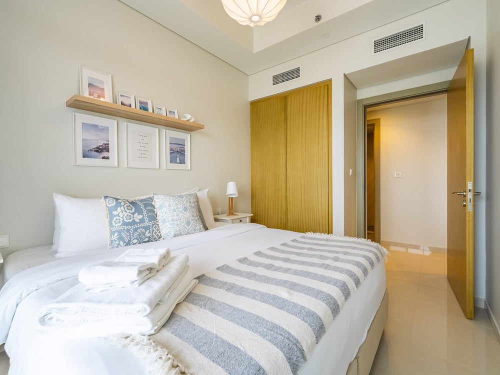 Bedroom with double bed, wardrobe and neutral decor