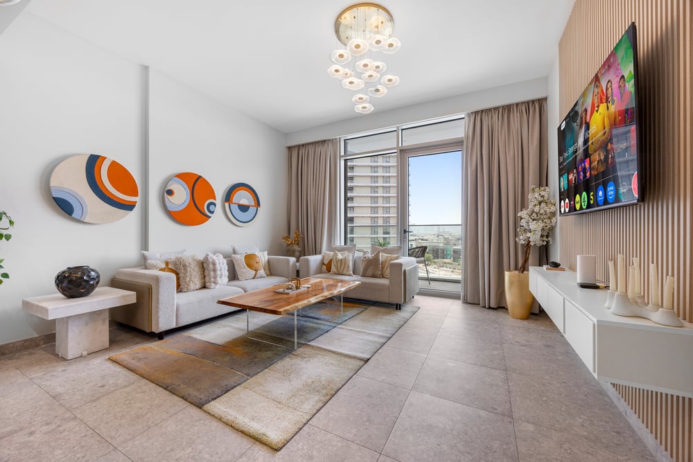 Living room with sofas large window and wall art