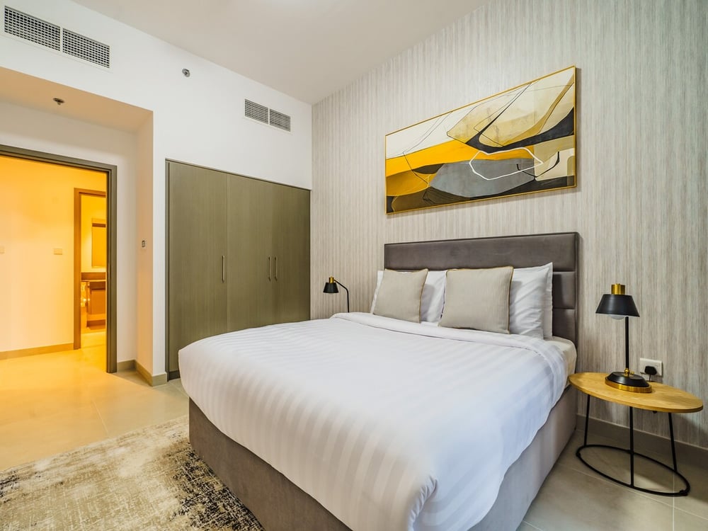 Second bedroom with king bed and a wardrobe