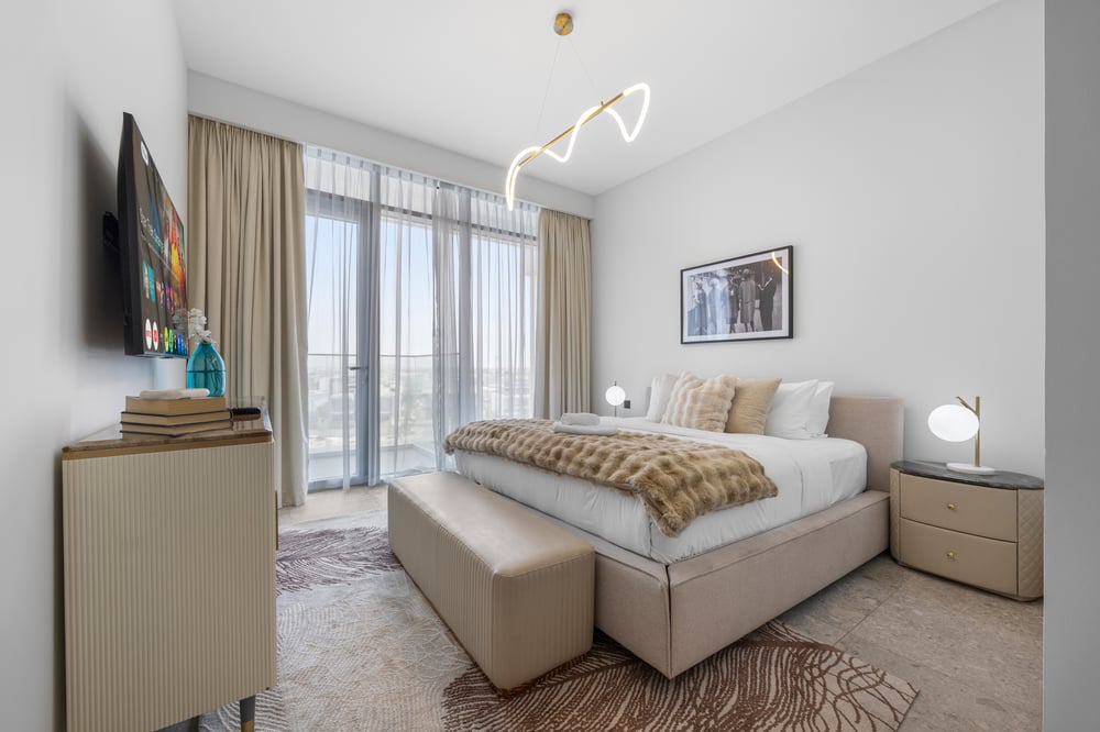 Bedroom 1 with double bed TV and balcony access