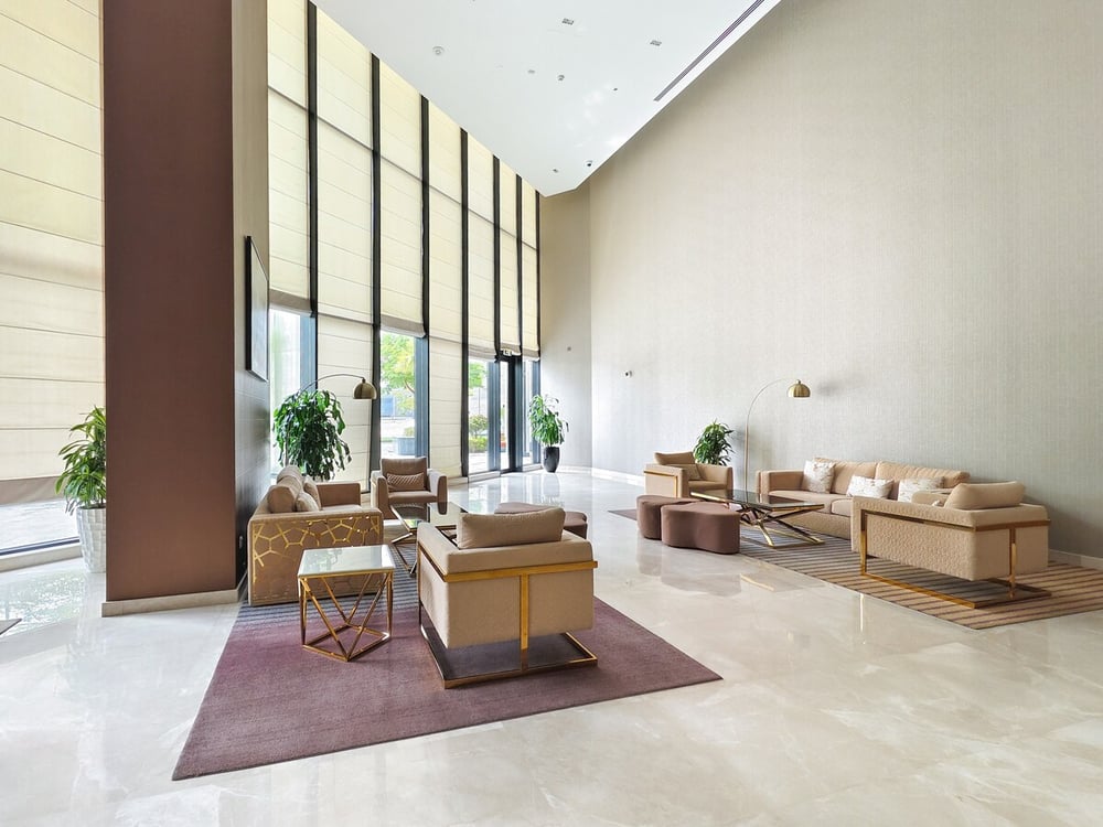 Building lobby with high ceilings and lounge seating