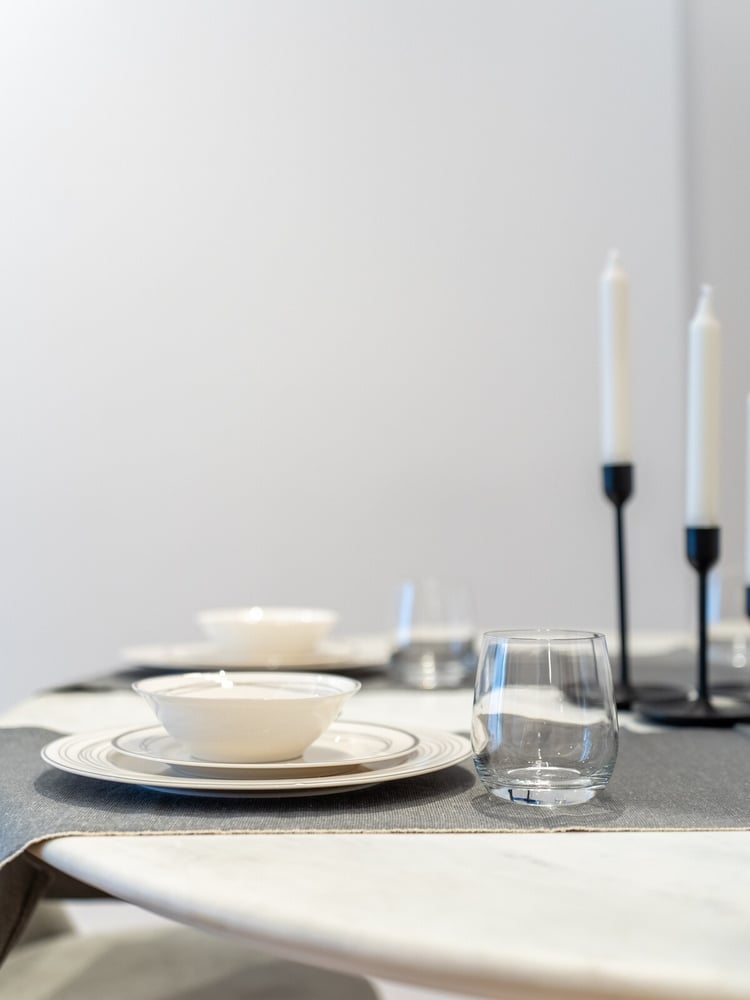 Dining table set with plates and candles