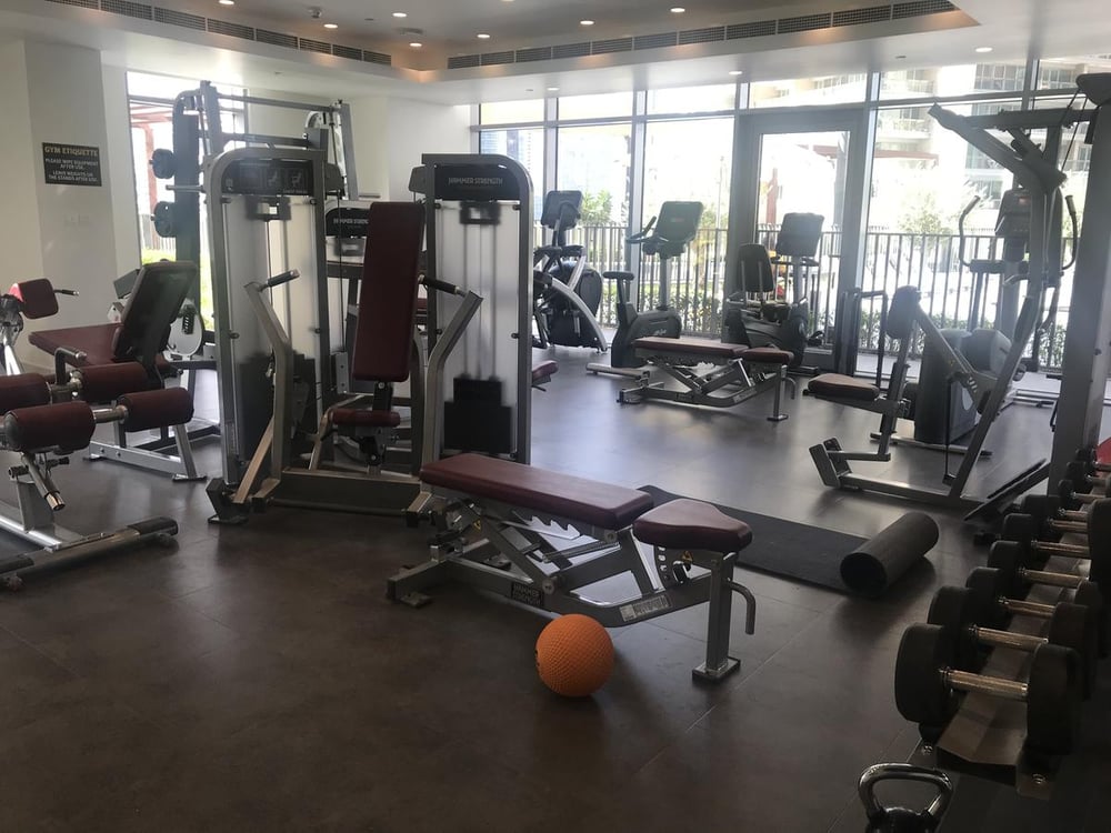 Building gym with weight machines and dumbbells